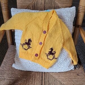 Handmade toddler cardigan, corn yellow with burgandy rocking horses, sz 18 month